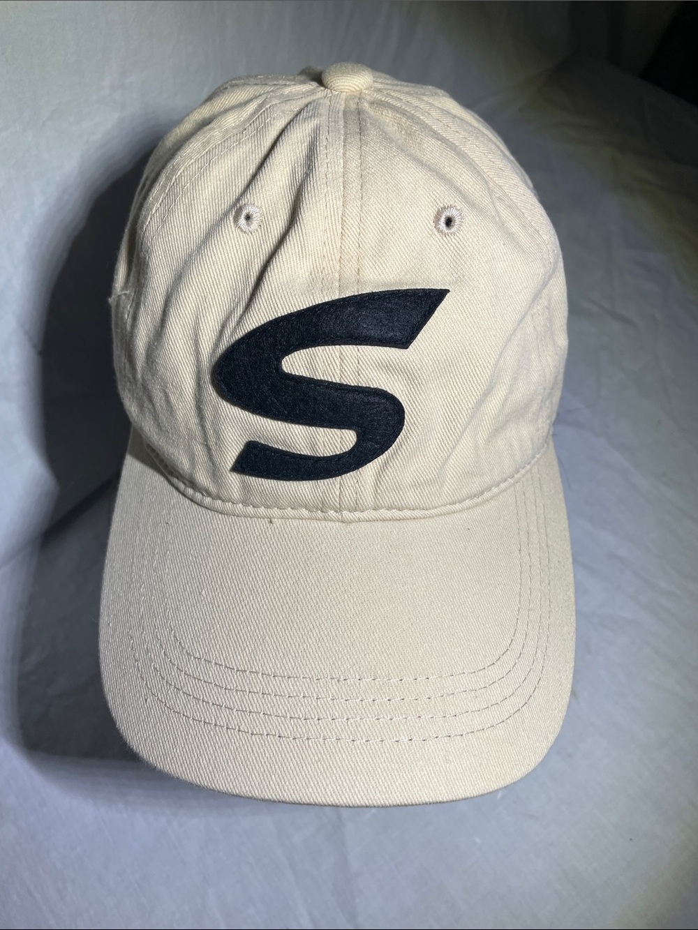 Beige Baseball Cap with Black 'S' Accent